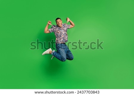 Full length photo of excited crazy man wear stylish clothes indicate himself champion winner success isolated on green color background