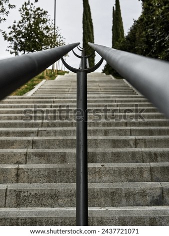 Ascent Perspective: Stairway View Through Railing Royalty-Free Stock Photo #2437721071