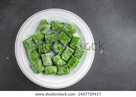 frozen spinach portion cube semifinished fresh food tasty healthy eating cooking meal snack on the table copy space food background rustic  Royalty-Free Stock Photo #2437729417