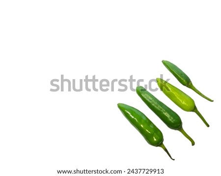 Long green Chilies pepper in corner decoration isolated on white background