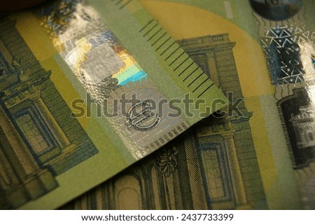 Euro symbol. A fragment of a 100 euro banknotes with a hologram. Euro symbol. High quality photo