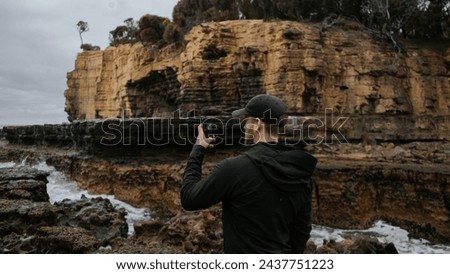 Man in Tasmania Australia taking pictures