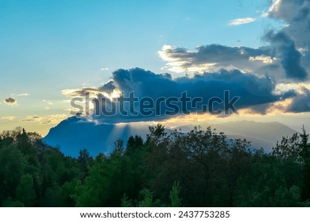 Scenic sunset view of iconic mountain peak Dobratsch seen from Altfinkenstein at Baumgartnerhoehe, Carinthia, Austria. Tranquility on hiking trail. Overlooking Villach area surrounded by Austrian Alps Royalty-Free Stock Photo #2437753285