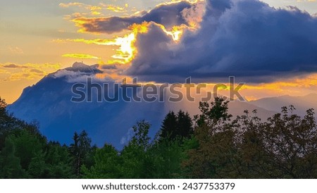 Scenic sunset view of iconic mountain peak Dobratsch seen from Altfinkenstein at Baumgartnerhoehe, Carinthia, Austria. Tranquility on hiking trail. Overlooking Villach area surrounded by Austrian Alps Royalty-Free Stock Photo #2437753379