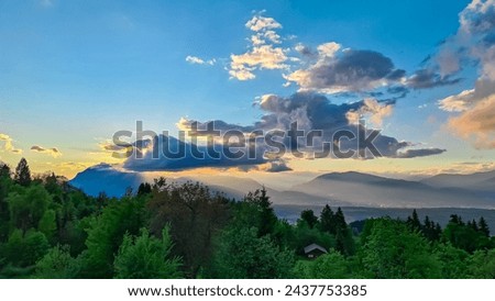 Scenic sunset view of iconic mountain peak Dobratsch seen from Altfinkenstein at Baumgartnerhoehe, Carinthia, Austria. Tranquility on hiking trail. Overlooking Villach area surrounded by Austrian Alps Royalty-Free Stock Photo #2437753385