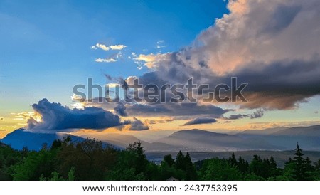 Scenic sunset view of iconic mountain peak Dobratsch seen from Altfinkenstein at Baumgartnerhoehe, Carinthia, Austria. Tranquility on hiking trail. Overlooking Villach area surrounded by Austrian Alps Royalty-Free Stock Photo #2437753395