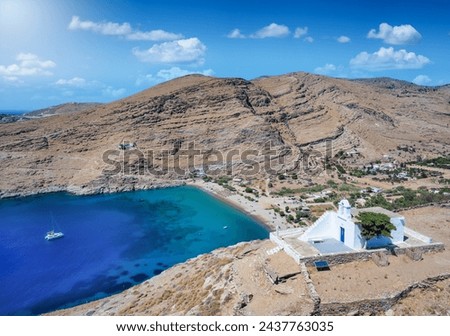 Aerial view of the beautiful bay and beach of Pisses, Kea, Tzia island, Greece, with the little chapelle of Panagia Sotira in front Royalty-Free Stock Photo #2437763035