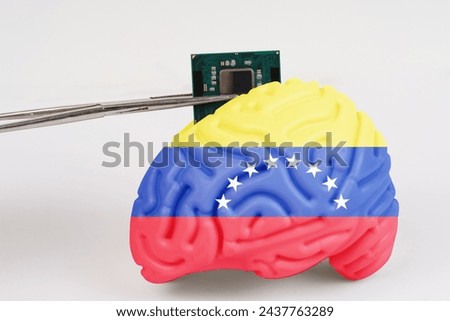 On a white background, a model of the brain with a picture of a flag - Venezuela, a microcircuit, a processor, is implanted into it. Close-up
