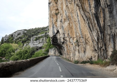 a narrow mountain road along steep cliffs