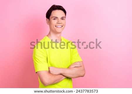 Photo portrait of pretty teenager guy folded hands confident pose dressed stylish yellow outfit isolated on pink color background