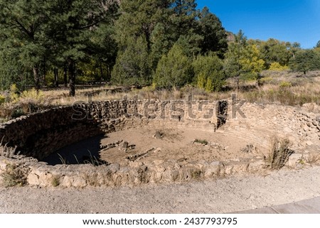 Big Kiva at Bandelier National Monument in New Mexico. Ancestral Puebloans big kiva once had a roof covering it and was a communal meeting place, an important part of the ceremonial cycle and culture. Royalty-Free Stock Photo #2437793795