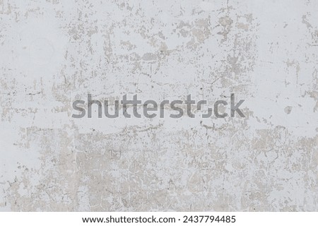 grey wall of old house with scratched plaster, pattern, vintage texture, background for banner, copy space