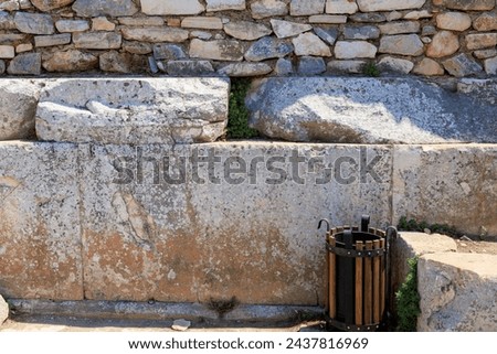 Antique wall made of huge blocks with minimal gaps. Background with selective focus and copy space for text