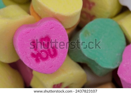 I Heart You Candy Heart on Pile of Other Hearts Background Image