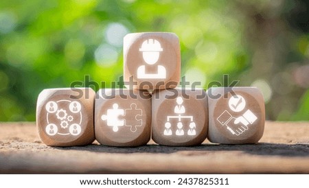Trade union concept, Wooden block on desk with trade union icon on virtual screen. Royalty-Free Stock Photo #2437825311