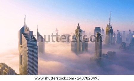 The holiday paradise of the Arab countries, Dubai. The most beautiful sights of Dubai. The famous buildings of Dubai. Places to visit in Dubai. Vacationing. Wealth and corporate buildings. Royalty-Free Stock Photo #2437828495
