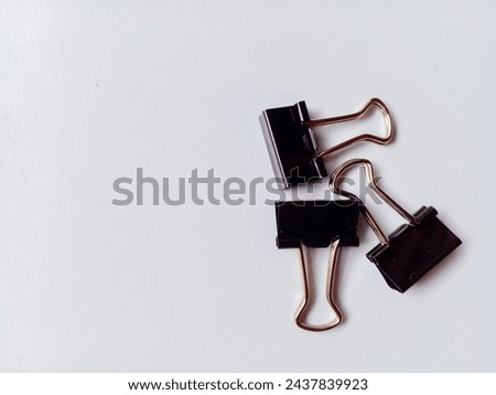 Paperclips isolated on white background. Equipment for office needs.