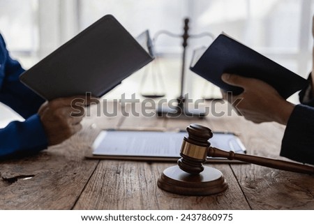 Judge hammer and justice lawyer having team meeting at law office Male businessman and lawyer discuss team meeting with client Legal business, near term