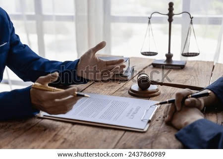 Judge hammer and justice lawyer having team meeting at law office Male businessman and lawyer discuss team meeting with client Legal business, near term