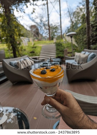 Sumptuous mango pudding topped with fresh fruit, a delectable and refreshing dessert bursting with tropical flavor and creamy texture. Royalty-Free Stock Photo #2437863895