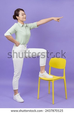 Photo of young Asian business woman sitting on chair