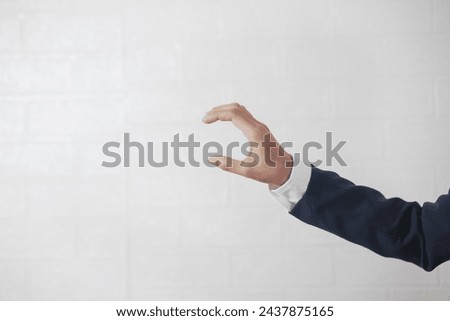 Close-upFemale hands wearing a business suit, white background