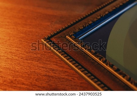 The corner of the frame of the wall painting, close-up. View from the top Royalty-Free Stock Photo #2437903525