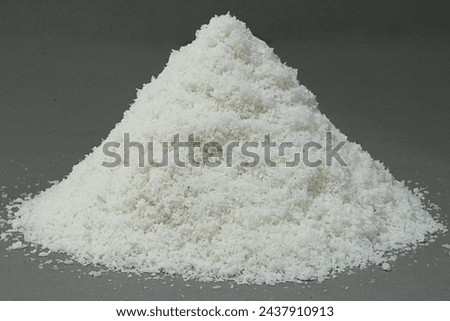 Desiccated coconut, made from dried coconut meat, offers several health benefits and culinary uses:

Rich in Nutrients: Desiccated coconut contains essential nutrients such as fiber, manganese, copper Royalty-Free Stock Photo #2437910913