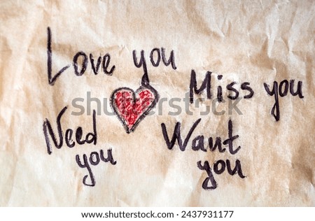 Miss you ,love you , want you note on crumpled paper