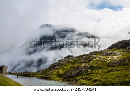 Clouds covering the mountains at the viewing station on Trollveggen Norway. High quality photo Royalty-Free Stock Photo #2437934141