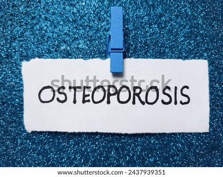 Osteoporosis writting on blue background.