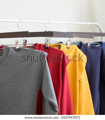 The clothes display looks Modern Minimalist Casual Comfortable hanging
