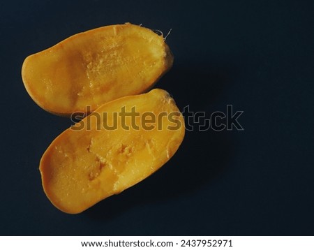 Sliced ​​mango on black background