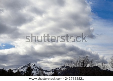 Dramatic clouds over the mountains of the Alps in spring