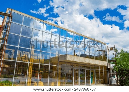 Bus Station building in Krichim town repair works,Beautiful blue skies with white summer clouds over new public building.Picture taken on July 11 th 2014. Krichim town,Plovdiv district,Bulgaria