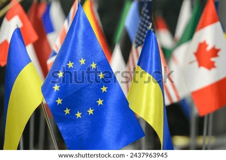 The national flag of Ukraine and the flags of the European Union and the another counties flags background