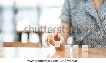 Health insurance conceptual. Hand holding wooden cube with healthcare medical icon.