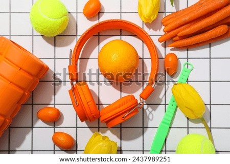 Sports tools with flowers on a light checkered background.