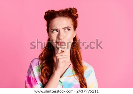 Portrait of funny gorgeous woman with foxy hairstyle wear print shirt tricky look at promo empty space isolated on pink color background Royalty-Free Stock Photo #2437995211