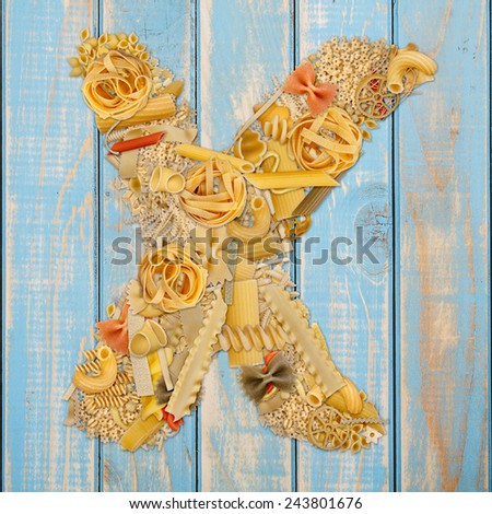Letter X made from pasta on a blue wooden  background 