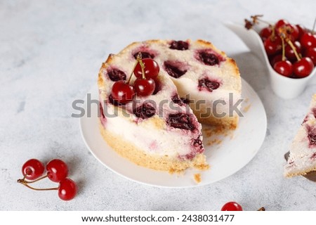 Delicious homemade cold cheesecake with red cherry jelly.