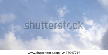 slightly cloudy sky in the afternoon Royalty-Free Stock Photo #2438047719