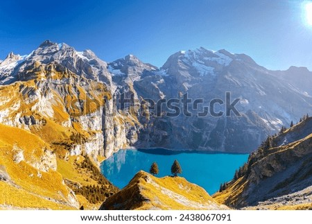 Oeschinen Lake near Kandersteg, Switzerland during autumn season. Royalty-Free Stock Photo #2438067091