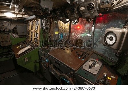 Interior of old battle ship's engine room control compartment