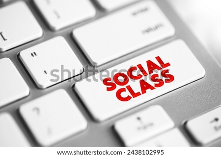 Social Class is a grouping of people into a set of hierarchical social categories, text concept button on keyboard Royalty-Free Stock Photo #2438102995