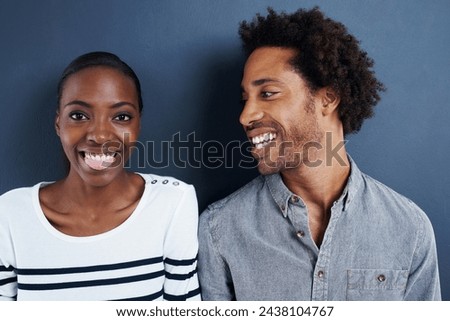 Happy, portrait and black couple with love relax on studio background together with funny moment. Crazy, face and care for partner in silly profile picture of people with casual fashion or style