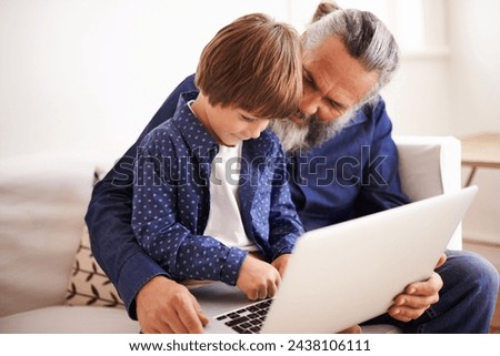 Grandfather, son and laptop on couch with love and bonding together with online games in living room. Happy family, boy and computer for cartoons in lounge, relax and movie subscription on holiday