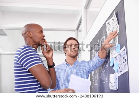 Business people, thinking and creative by chalkboard in office for storyboard drawing and animation illustration. Graphic design, employees and teamwork by blackboard with idea for cartoon project