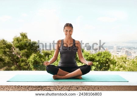 Woman, portrait and meditation outdoor for peace zen with city view on yoga mat for mindfulness, pilates or wellbeing. Female person, hands and face on balcony for calm spirituality, nature or relax