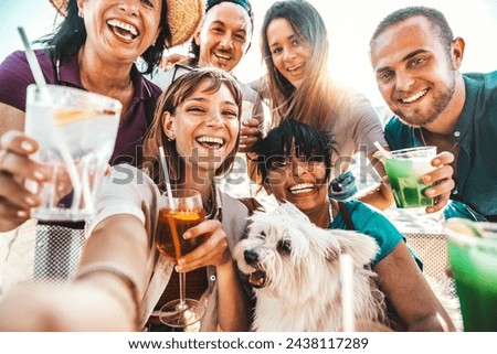 Group of happy people enjoying cocktail party sitting at bar restaurant - Happy friends toasting gin tonic and mojitos together - Food and beverage life style concept